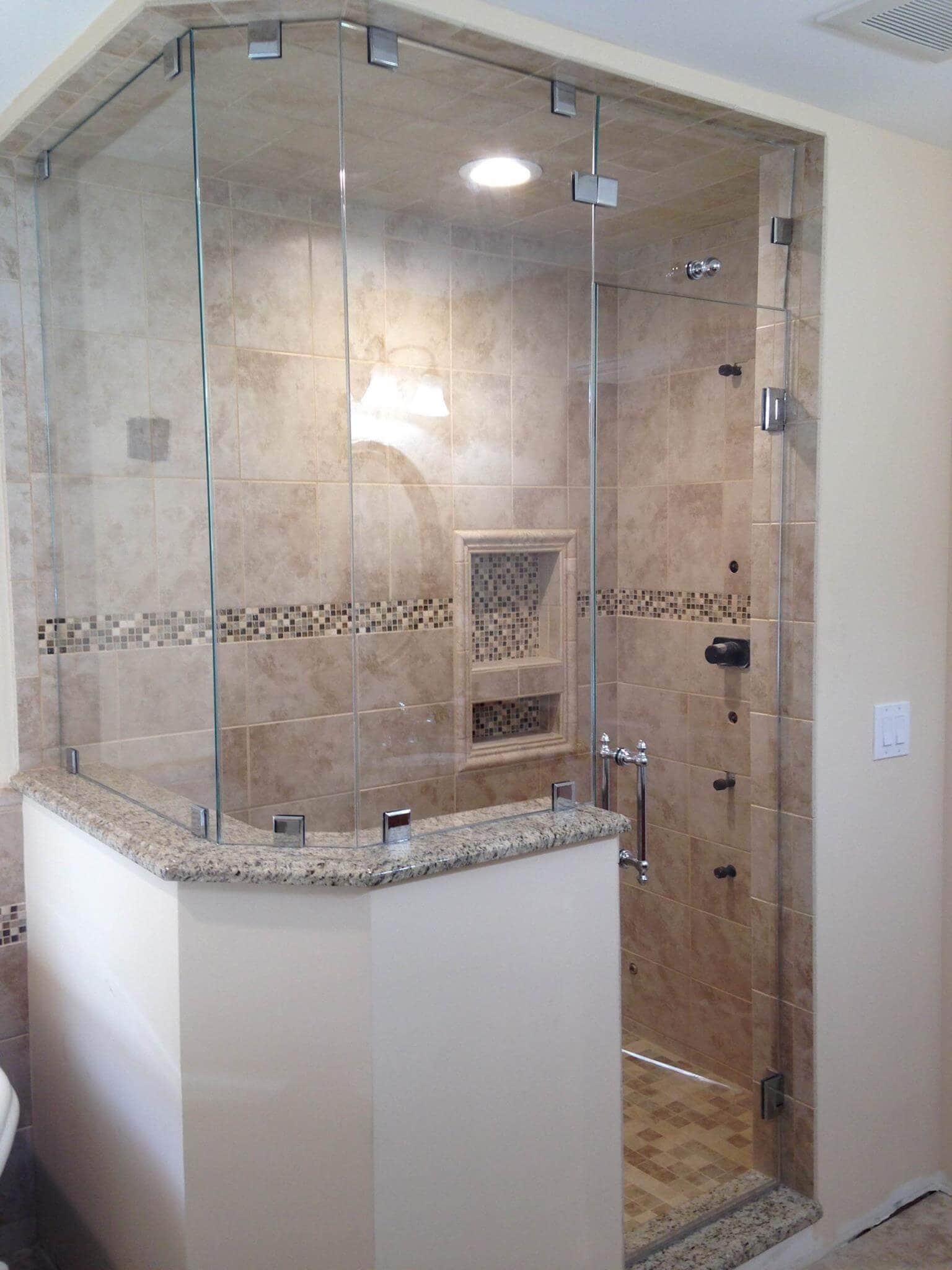 Elegant Shower Enclosure with Glass Doors. High-quality glass shower door enclosure with modern chrome hardware and ceramic tile interior.