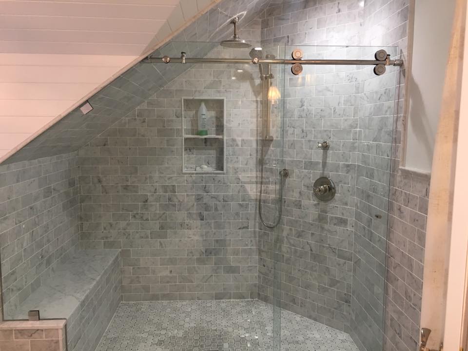 Sleek Glass Shower Door. High-quality frameless glass shower door with modern hardware, enhancing bathroom elegance.