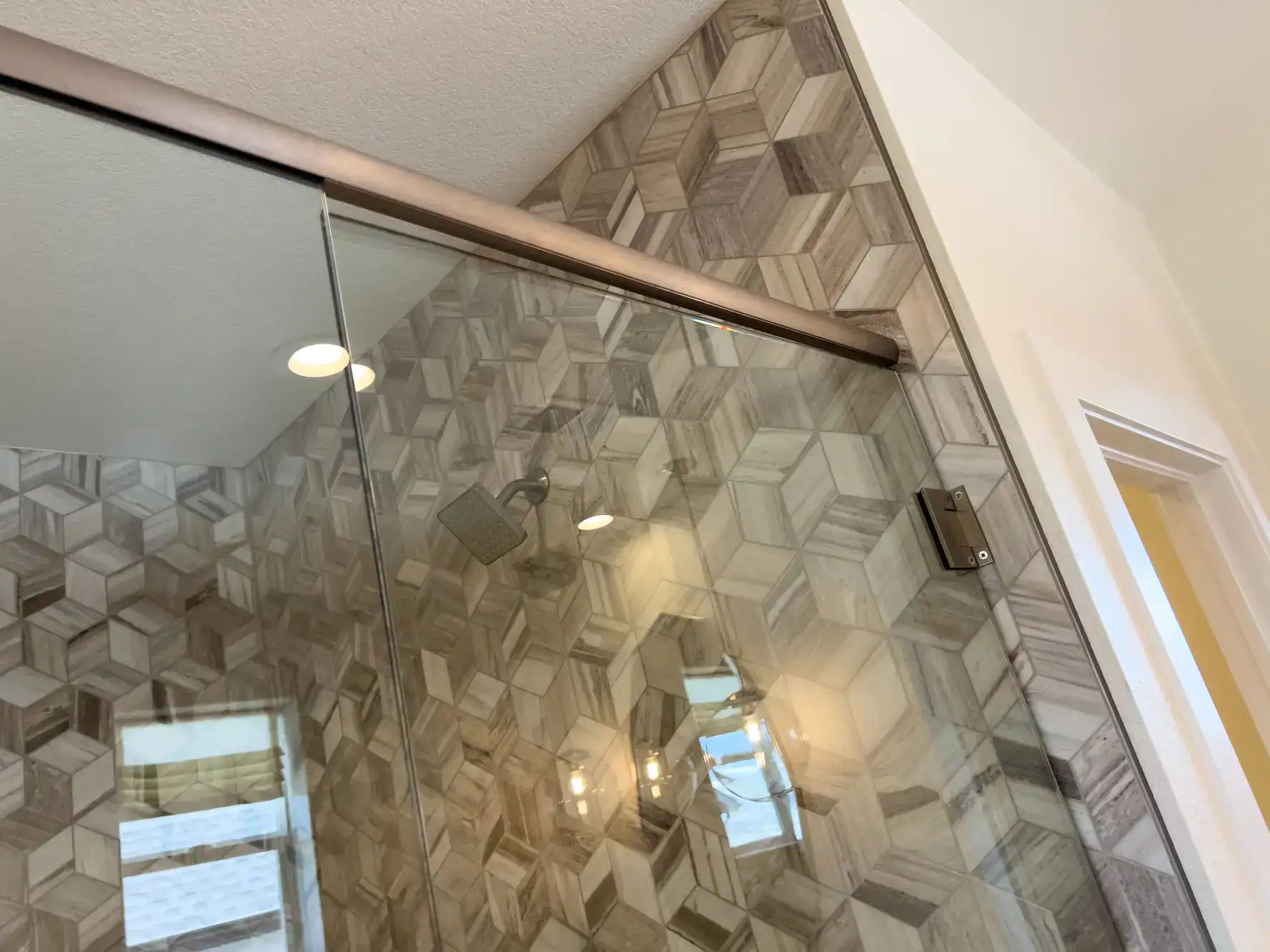 High-quality glass shower enclosure with stylish tile design for a contemporary bathroom look.