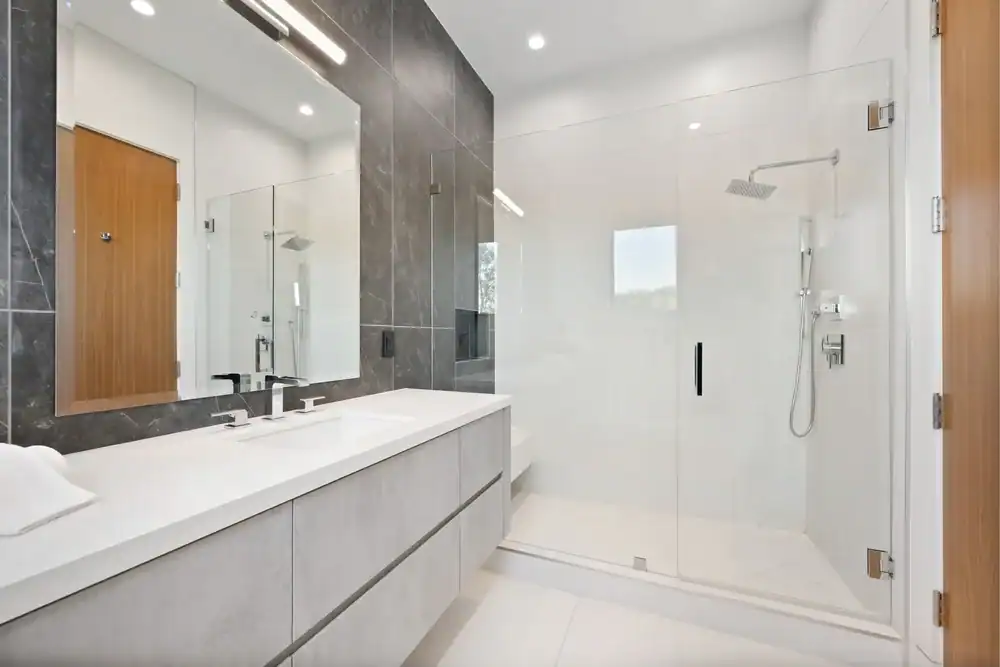 Frameless glass shower door with sleek modern design, ideal for contemporary bathrooms and waterproofing.